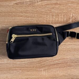 TUMI Black Belt Bag with Gold Accents
